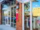 Storefront view of Ember Yoga with large windows displaying athletic wear and accessories at 399 Tillman Pass, Woodstock, GA 30188