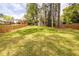 Spacious backyard featuring a well-manicured lawn and wooden fencing for privacy at 883 Wildwood Ne Rd, Atlanta, GA 30324