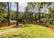 Wide backyard with green lawn and wooden fence, perfect for outdoor activities at 883 Wildwood Ne Rd, Atlanta, GA 30324