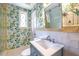 Bathroom featuring stylish wallpaper and a modern vanity with a large sink at 883 Wildwood Ne Rd, Atlanta, GA 30324