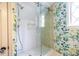 Bathroom with a glass-enclosed shower and unique wallpaper with animal prints at 883 Wildwood Ne Rd, Atlanta, GA 30324
