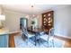 Charming dining area featuring hardwood floors, a china cabinet and a chandelier at 883 Wildwood Ne Rd, Atlanta, GA 30324