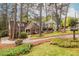 Beautifully landscaped front yard of home showcasing mature trees and meticulous lawn care at 883 Wildwood Ne Rd, Atlanta, GA 30324