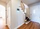 Bright foyer with hardwood floors, staircase, and classic interior doors at 883 Wildwood Ne Rd, Atlanta, GA 30324