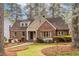 Charming brick home with lush landscaping, stone pathway, and inviting front porch at 883 Wildwood Ne Rd, Atlanta, GA 30324