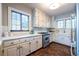 Traditional kitchen with white cabinetry, stainless steel appliances, and hardwood floors at 883 Wildwood Ne Rd, Atlanta, GA 30324
