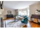 Cozy living room features hardwood floors, large windows, and comfortable seating arrangement at 883 Wildwood Ne Rd, Atlanta, GA 30324