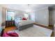 Well-lit main bedroom with a large bed, hardwood floors, and stylish furnishings, creating a cozy retreat at 883 Wildwood Ne Rd, Atlanta, GA 30324