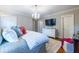 Cozy main bedroom featuring neutral tones, hardwood floors, and a chandelier providing a relaxing atmosphere at 883 Wildwood Ne Rd, Atlanta, GA 30324