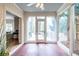 Bright sunroom with large windows overlooking the backyard and hardwood flooring at 883 Wildwood Ne Rd, Atlanta, GA 30324
