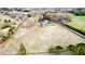 Expansive aerial view showcases a charming home surrounded by a lush landscape, offering privacy and serene country living at 85 Carroll Slough Rd, Kingston, GA 30145