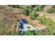 Aerial view of a home with a circular driveway, garage, and multiple RV parking spots at 85 Carroll Slough Rd, Kingston, GA 30145