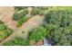 A lush, wooded area is revealed in this high angle shot, hinting at a secluded homesite at 85 Carroll Slough Rd, Kingston, GA 30145