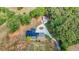 Drone shot reveals home's circular driveway, parking, modern architecture, and lush surroundings at 85 Carroll Slough Rd, Kingston, GA 30145