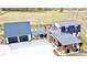 Overhead view shows the home's layout, attached garage, covered patio, and a spacious driveway with ample parking at 85 Carroll Slough Rd, Kingston, GA 30145