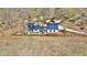 Aerial view of a lovely two-story home with a dark roof, surrounded by a wooden fence on a large lot at 85 Carroll Slough Rd, Kingston, GA 30145