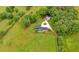 Sprawling property features a modern home, long driveway and lush greenery for a serene setting at 85 Carroll Slough Rd, Kingston, GA 30145