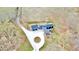 Home with a circular driveway, and three car garage on a large lot surrounded by trees at 85 Carroll Slough Rd, Kingston, GA 30145