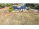 Drone shot highlighting the home's modern design, fenced yard, circular drive and ample parking at 85 Carroll Slough Rd, Kingston, GA 30145