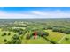 Expansive aerial view showcases a beautiful home nestled within a lush, green landscape at 85 Carroll Slough Rd, Kingston, GA 30145