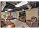 Cozy finished basement with a comfortable seating area and entertainment center at 85 Carroll Slough Rd, Kingston, GA 30145