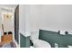 Clean bathroom showcasing a toilet with a stylish, dark green accent wall at 85 Carroll Slough Rd, Kingston, GA 30145