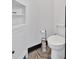 Modern half bathroom with a toilet and storage cabinet at 85 Carroll Slough Rd, Kingston, GA 30145