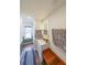 Bright bathroom with an illuminated mirror, white vanity, decorative rug, and wood accents at 85 Carroll Slough Rd, Kingston, GA 30145