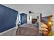 Bedroom with a queen bed, and an accent wall at 85 Carroll Slough Rd, Kingston, GA 30145