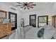 Bedroom with a bed, black framed windows, ceiling fan and white walls at 85 Carroll Slough Rd, Kingston, GA 30145