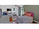 Cozy bedroom with two twin beds and a mounted TV at 85 Carroll Slough Rd, Kingston, GA 30145