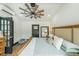 Bright bedroom featuring a decorative fan, windows, and neutral decor at 85 Carroll Slough Rd, Kingston, GA 30145
