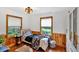 Cozy bedroom with natural light, wood floors, wood trim, and a comfortable bed at 85 Carroll Slough Rd, Kingston, GA 30145