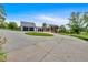 Long driveway leading to a modern farmhouse with attached garage and outdoor living spaces at 85 Carroll Slough Rd, Kingston, GA 30145