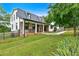 Stunning two-story home featuring stone accents, a black metal roof, and a well-manicured lawn at 85 Carroll Slough Rd, Kingston, GA 30145