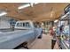 A large well lit garage features overhead lights and a classic truck with the hood up at 85 Carroll Slough Rd, Kingston, GA 30145