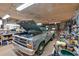 Spacious garage with workbench, tools, and classic truck with the hood up for car enthusiasts at 85 Carroll Slough Rd, Kingston, GA 30145
