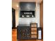 Charming kitchen cabinet and drawers, complete with open shelf and mug hooks at 85 Carroll Slough Rd, Kingston, GA 30145