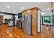 Spacious kitchen with stainless steel appliances, wooden cabinets, and hardwood floors at 85 Carroll Slough Rd, Kingston, GA 30145