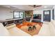 Cozy living room features a stone fireplace, wood floors, and stylish decor, perfect for relaxing and entertaining at 85 Carroll Slough Rd, Kingston, GA 30145