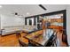 Open-concept living room with dining area, wood floors, and modern furnishings at 85 Carroll Slough Rd, Kingston, GA 30145