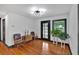 Bright living room featuring hardwood floors, black-framed windows, and stylish decor, creating a welcoming atmosphere at 85 Carroll Slough Rd, Kingston, GA 30145