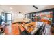 Open-concept living area with hardwood floors, a dining table, and a seamless flow into the kitchen at 85 Carroll Slough Rd, Kingston, GA 30145