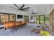 Spacious sunroom with lots of natural light, ceiling fans, and a TV at 85 Carroll Slough Rd, Kingston, GA 30145