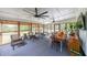 Relaxing sunroom with ample seating, a dining table, and views of the backyard at 85 Carroll Slough Rd, Kingston, GA 30145