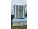 OXBOX AC unit is outside the house on a concrete slab surrounded by the landscaped yard at 2520 Legend Mill Run, Dacula, GA 30019