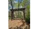 Picturesque arbor with a bench, perfect for relaxation and enjoying nature at 2520 Legend Mill Run, Dacula, GA 30019