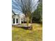 View of the backyard with patio and retaining wall at 2520 Legend Mill Run, Dacula, GA 30019