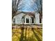 Rear view of home with backyard patio and brick retaining wall at 2520 Legend Mill Run, Dacula, GA 30019