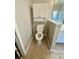 Toilet area includes overhead cabinet and shelf at 2520 Legend Mill Run, Dacula, GA 30019